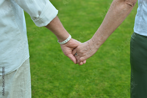 Elderly couple holding
