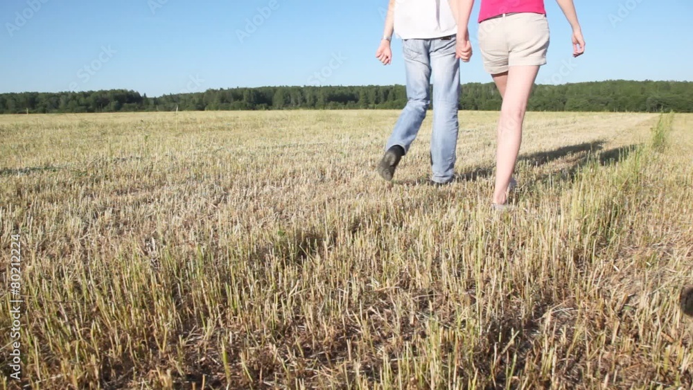 guy with girl go to hold for hands on oblique field to wood guy with girl go to hold for hands on oblique field to wood
