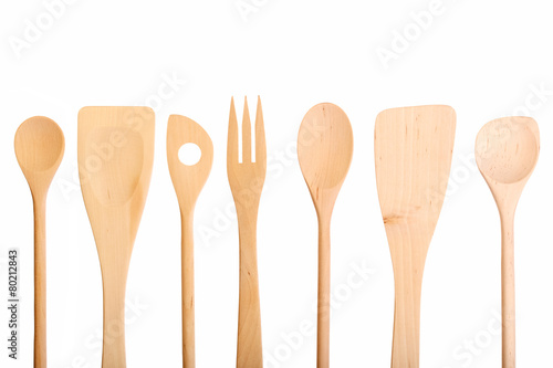 Set of new wooden kitchen utensils (spoons) isolated on white. photo