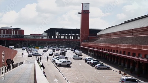 People walk at parking near Atocha railway station 