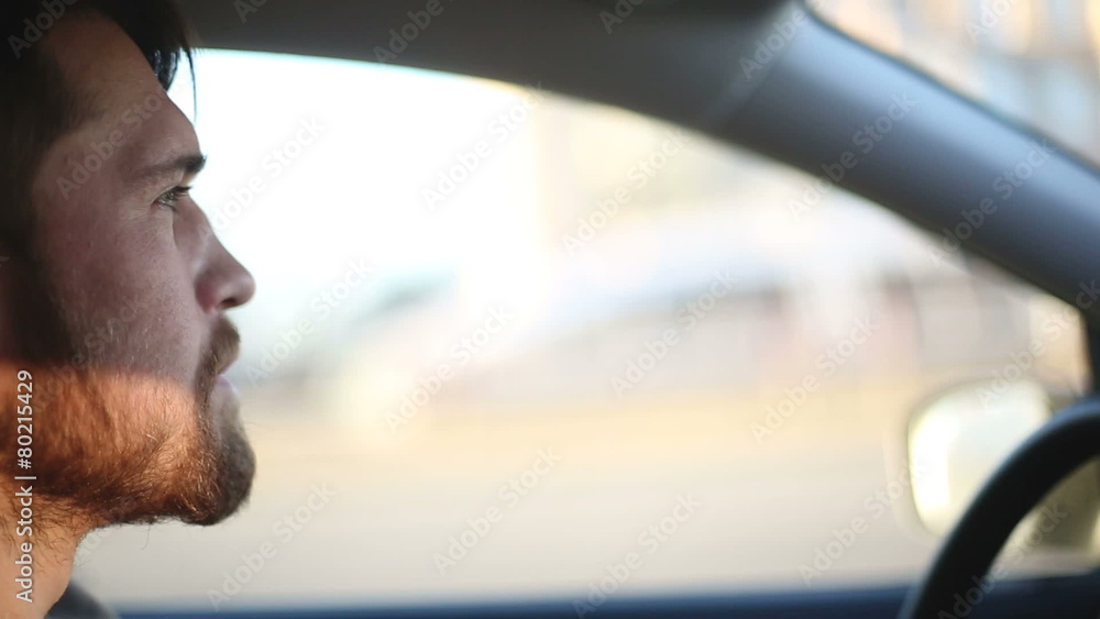 A man drives a car at sunset A man drives a car at sunset