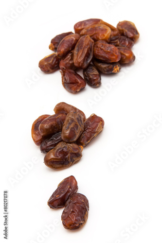 Medjool dates isolated on a white background.