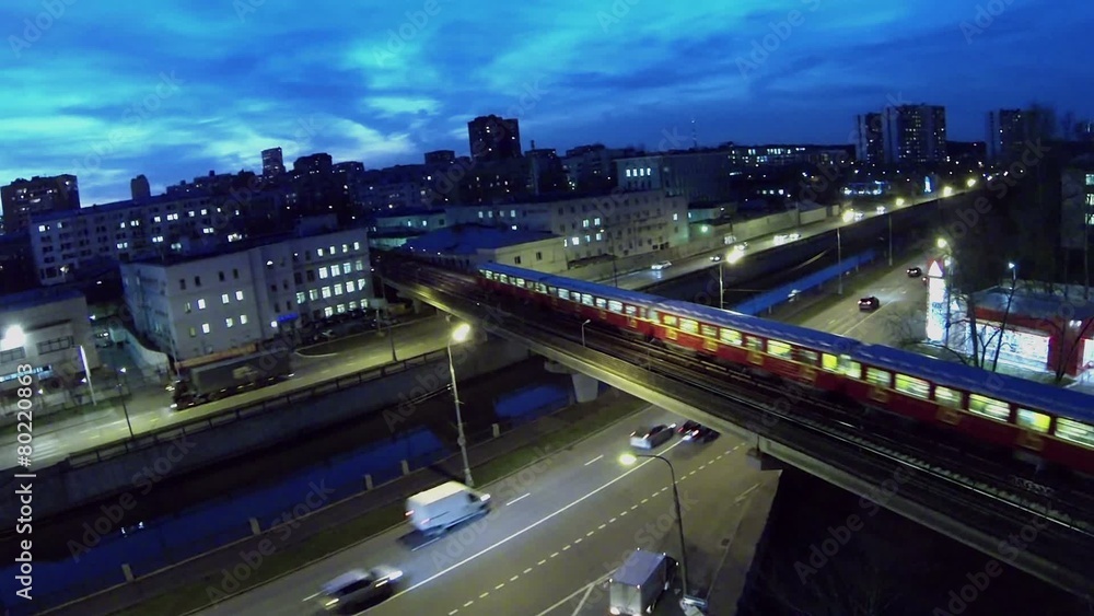 Red metro train rides by Preobrazhensky bridge over Yauza river Red metro train rides by Preobrazhensky bridge over Yauza river