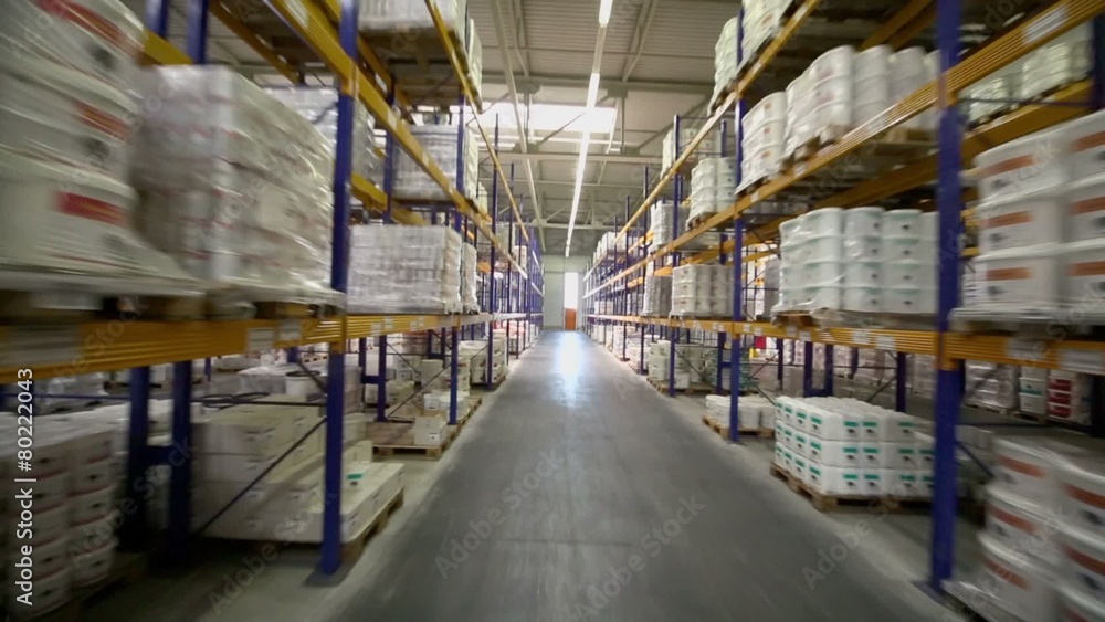 Motion through aisle in warehouse of Caparol factory Motion through aisle in warehouse of Caparol factory