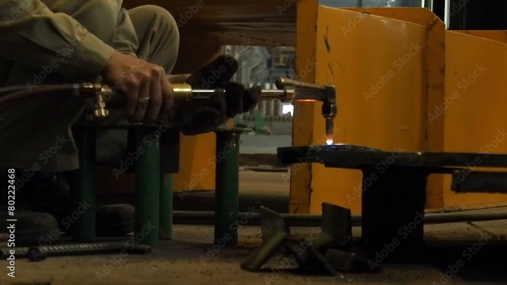 Worker cutting steel by using metal torch, 60 fps. Worker cutting steel by using metal torch, 60 fps.