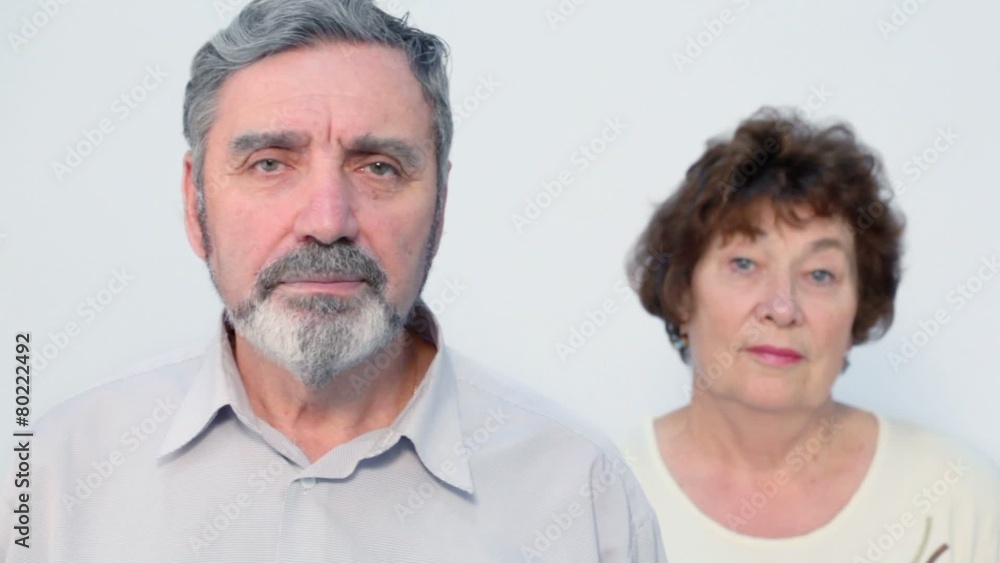 Portrait of senior couple, focus on man, isolated at white Portrait of senior couple, focus on man, isolated at white