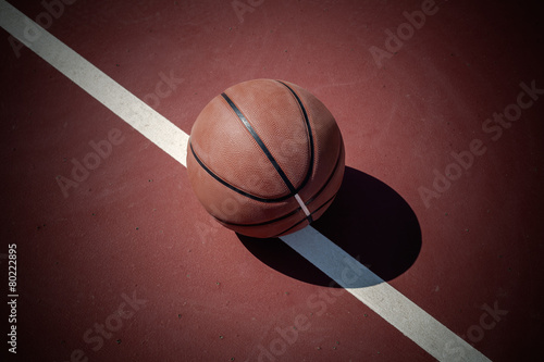 Closeup basketball ball on outdoor court