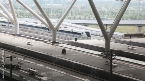 Arrival of high-speed train to the platform the railway station for high speed trains photo