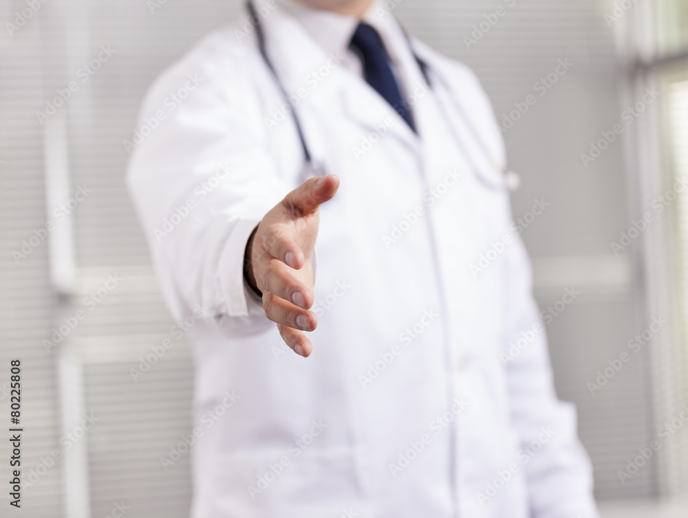 Doctor with open hand ready for handshake Doctor with open hand ready for handshake