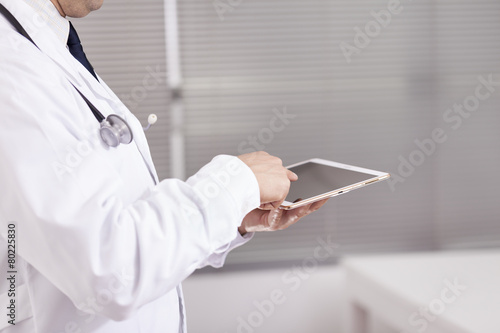 Doctor working with a digital tablet