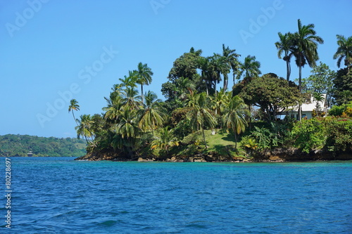 Tropical island with an house viewed from the sea