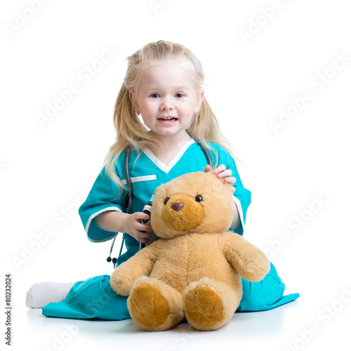 kid girl playing doctor wit...
