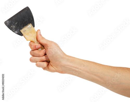 Old rubber trowel in male hand