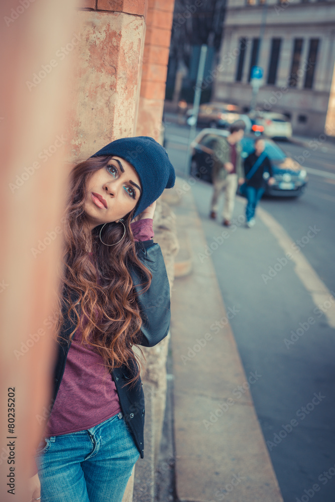 Fototapeta premium Beautiful girl posing in an urban context