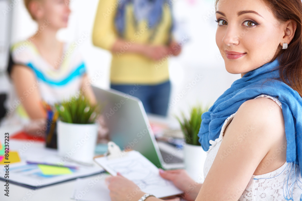 Portrait of attractive female designer in office Portrait of attractive female designer in office