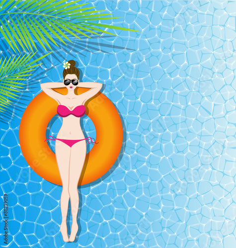 Woman in bikini relaxing on inflatable mattress in the sea