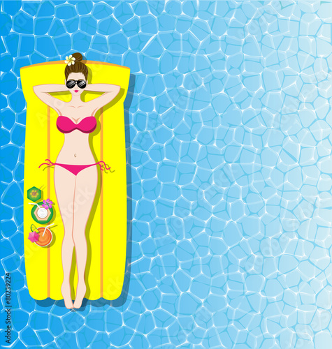 Woman relaxing on inflatable mattress in the sea