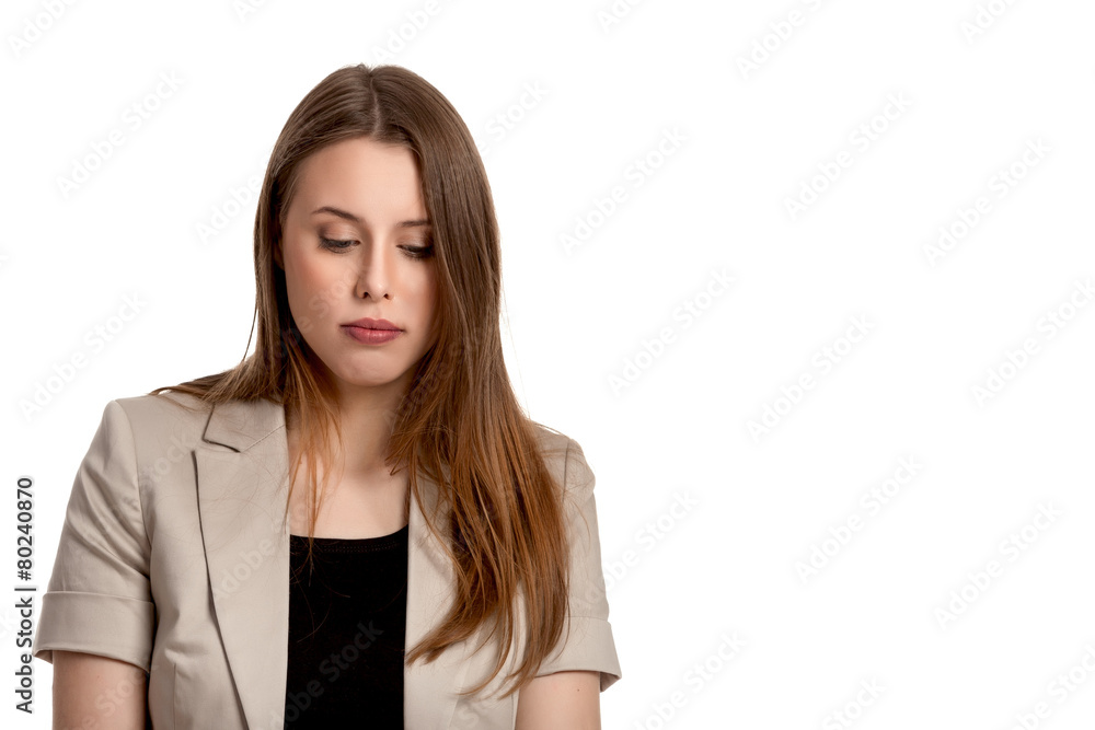 Young woman thinking and looking down Young woman thinking and looking down