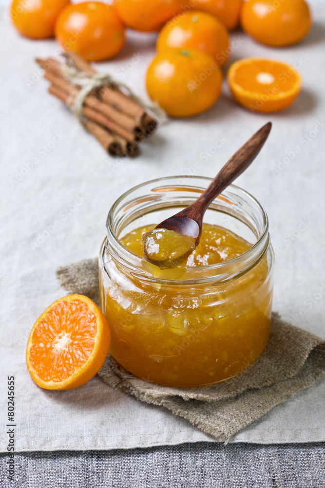 jar with tangerine jam on a linen napkin jar with tangerine jam on a linen napkin