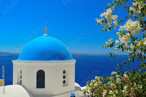 Beautiful blue dome church in Oia, Santorini, Cyclades, Greece