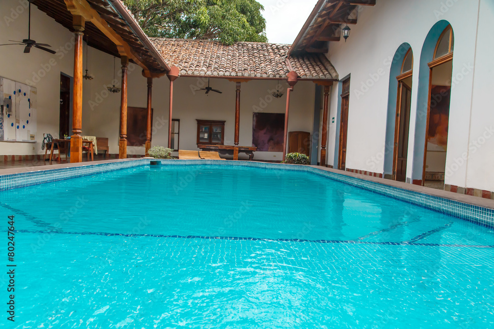 pool in garden in colonial house