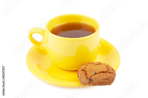 Cup of tea and chocolate cookies on a white background isolated