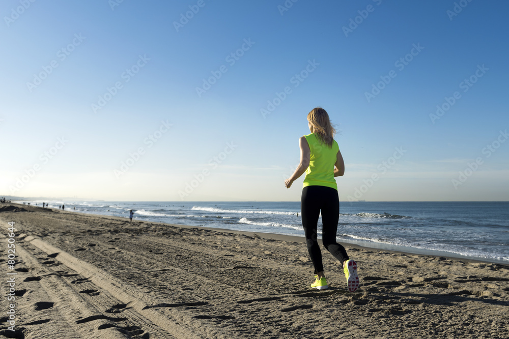 A lady running on the beach