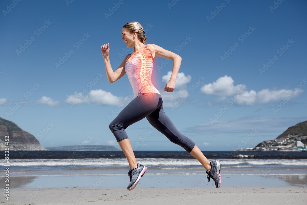 Highlighted back bones of jogging woman on beach Highlighted back bones of jogging woman on beach