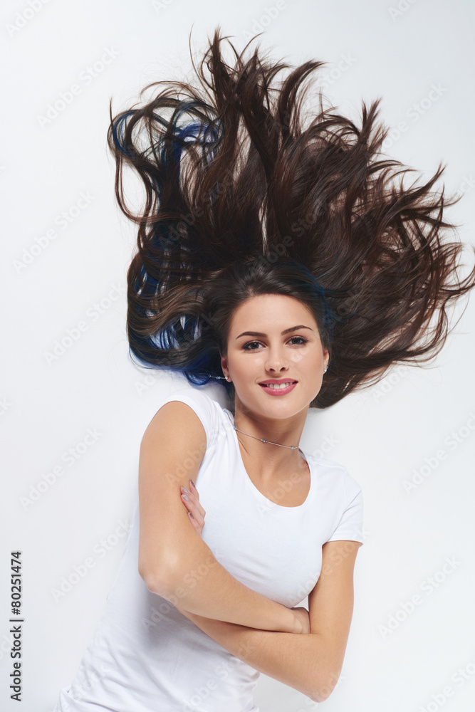 Top view of woman lying on floor on back Top view of woman lying on floor on back