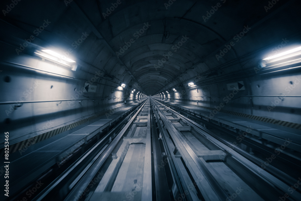 Subway tunnel and blurred light trails