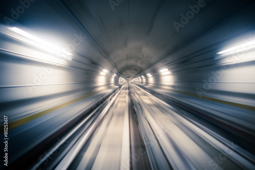 Subway tunnel and blurred light trails photo