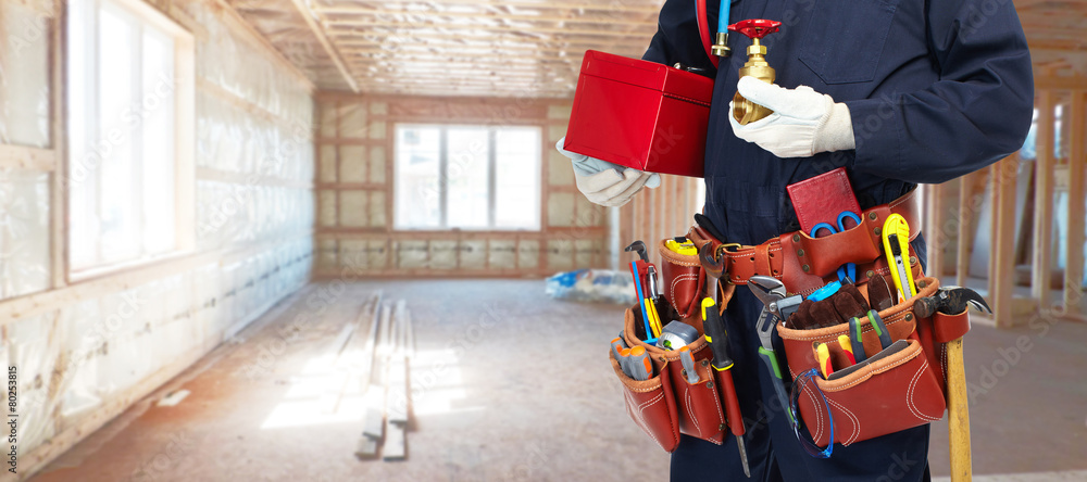 Obraz premium Builder handyman with construction tools.
