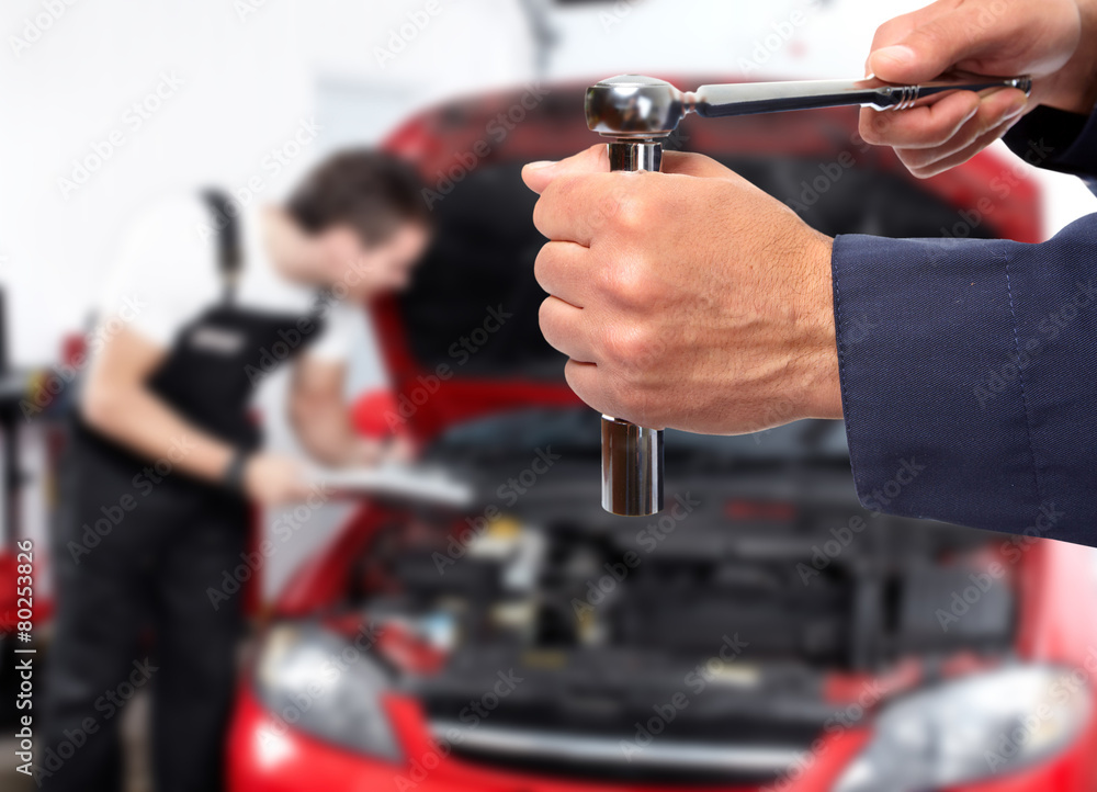 Hand of car mechanic with wrench. Hand of car mechanic with wrench.