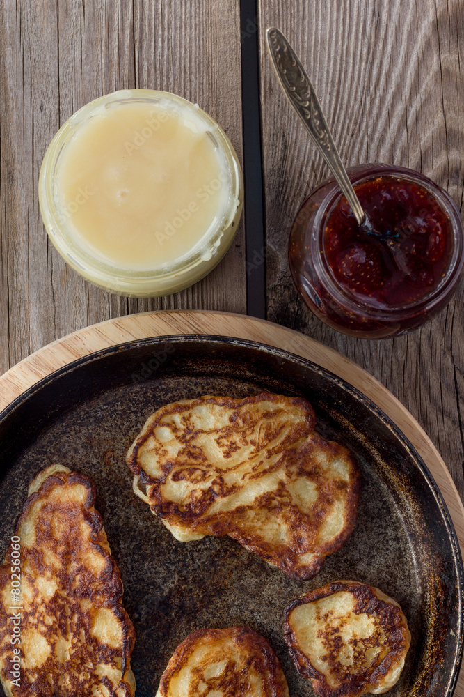 Pan with pancakes, jam, honey rustic