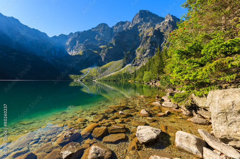Green water mountain lake Morskie Oko, Tatra Mountains, Poland - obrazy, fototapety, plakaty 