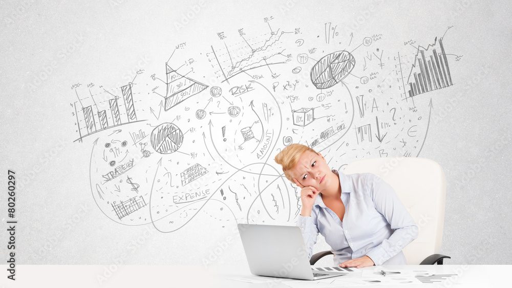 Business woman at desk with hand drawn charts Business woman at desk with hand drawn charts