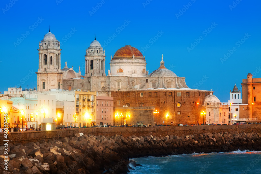  Cathedral and  embankment in evening time. Cadiz