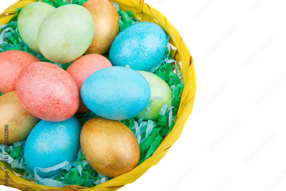 multicolored Easter eggs in a basket multicolored Easter eggs in a basket