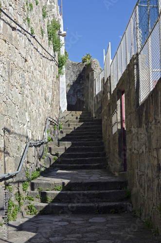 Fototapeta Naklejka Na Ścianę i Meble -  Staircase and a narrow street