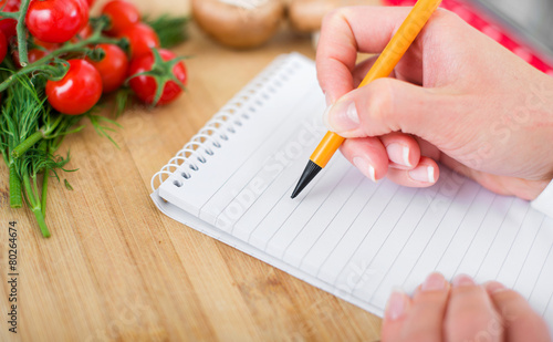 Chef writing the recipe