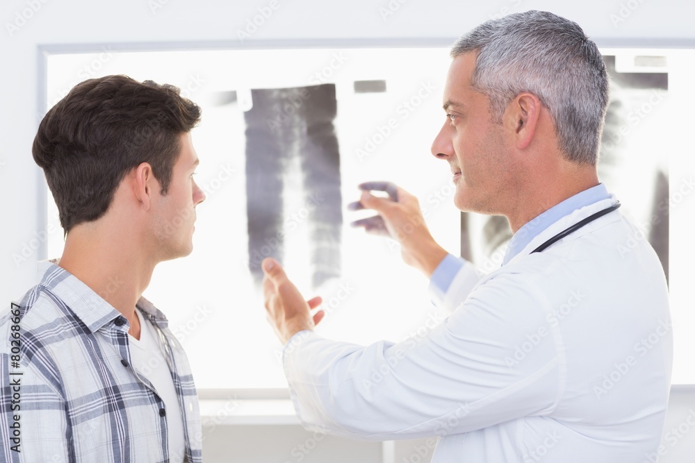Fototapeta premium Doctor explaining X rays to his patient