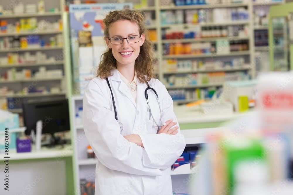 Pharmacist in lab coat with stethoscope and arms crossed Pharmacist in lab coat with stethoscope and arms crossed