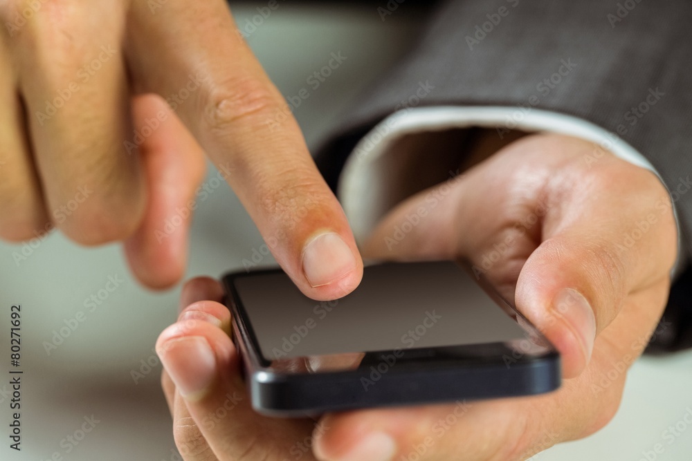Businessman using his smart phone Businessman using his smart phone