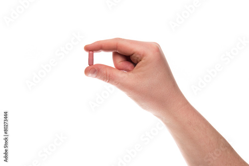 Hand with a pill