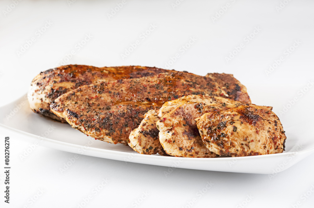 Grilled chicken breast on white plate Grilled chicken breast on white plate
