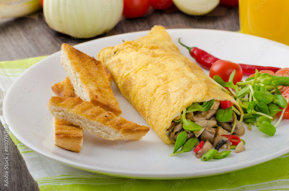 Omelette stuffed with mushrooms and microgreens Omelette stuffed with mushrooms and microgreens