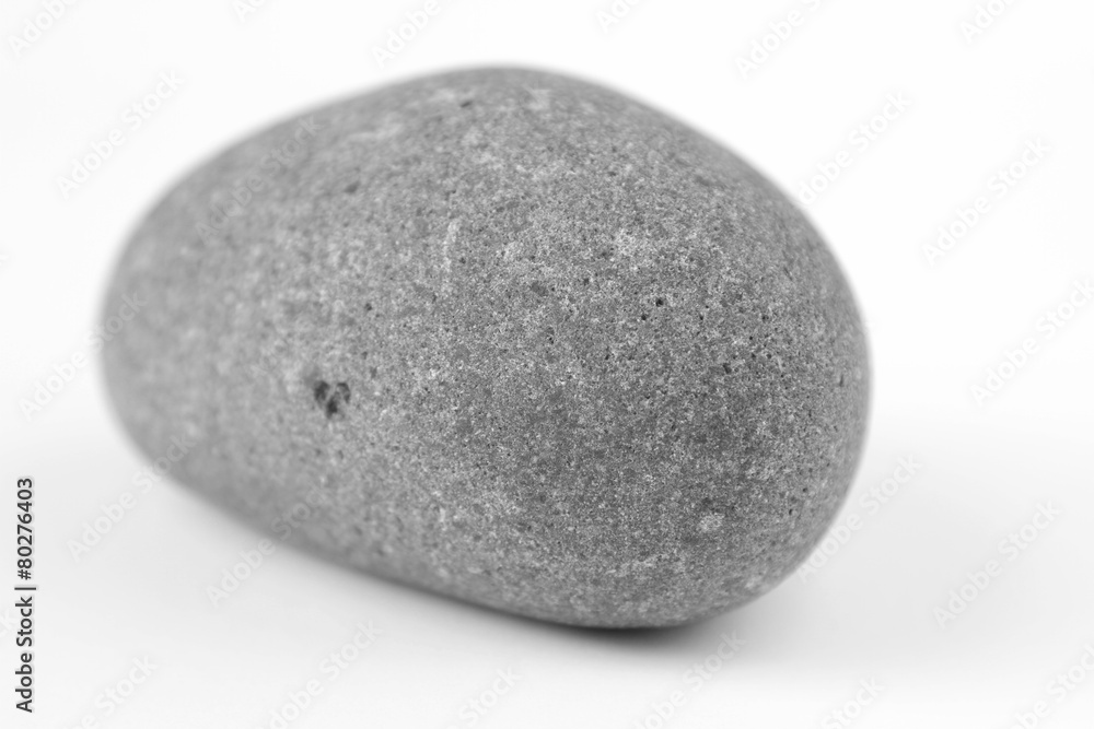 One rock on plain background One rock on plain background