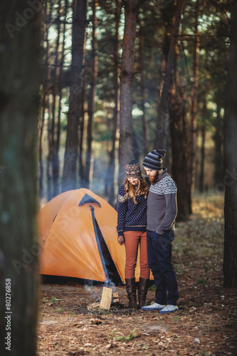 Couple tent camping in the wilderness