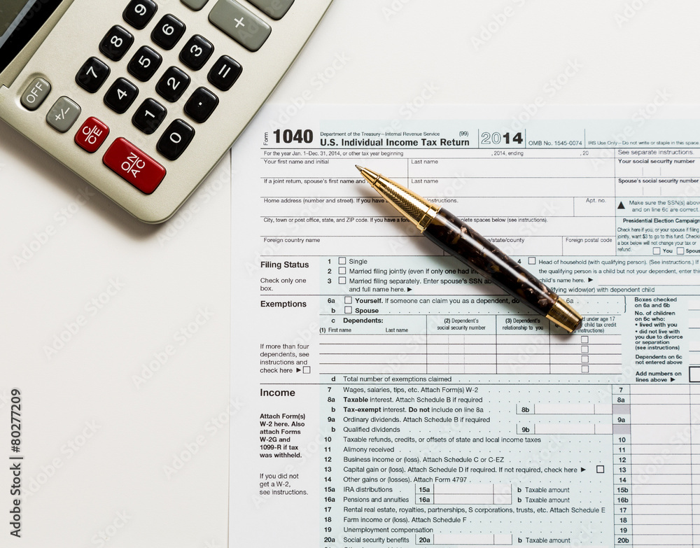 Pen and calculator on 2014 form 1040 Pen and calculator on 2014 form 1040