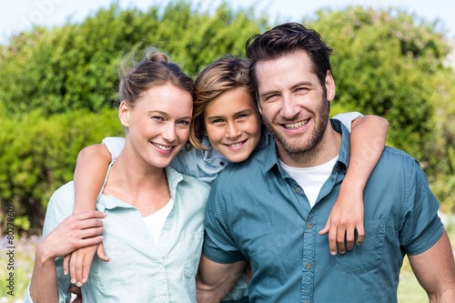 Happy family smiling at camera